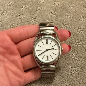 Gucci Silver Timepiece with White Face